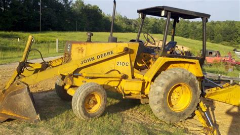 john deere 210c backhoe loader with skid steer implement mounting|john deere 210 backhoe specs.